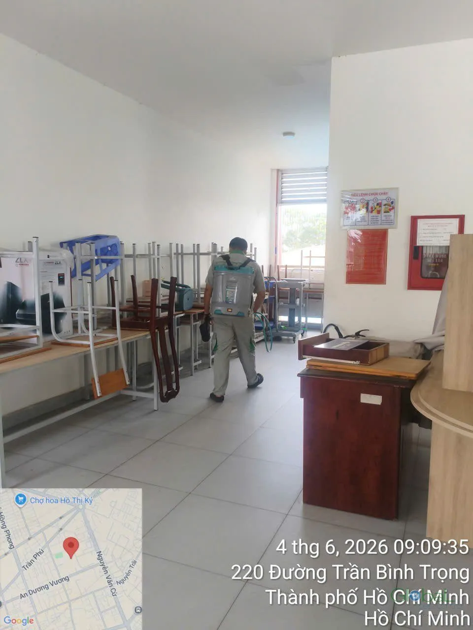A technician treating a school furniture store room