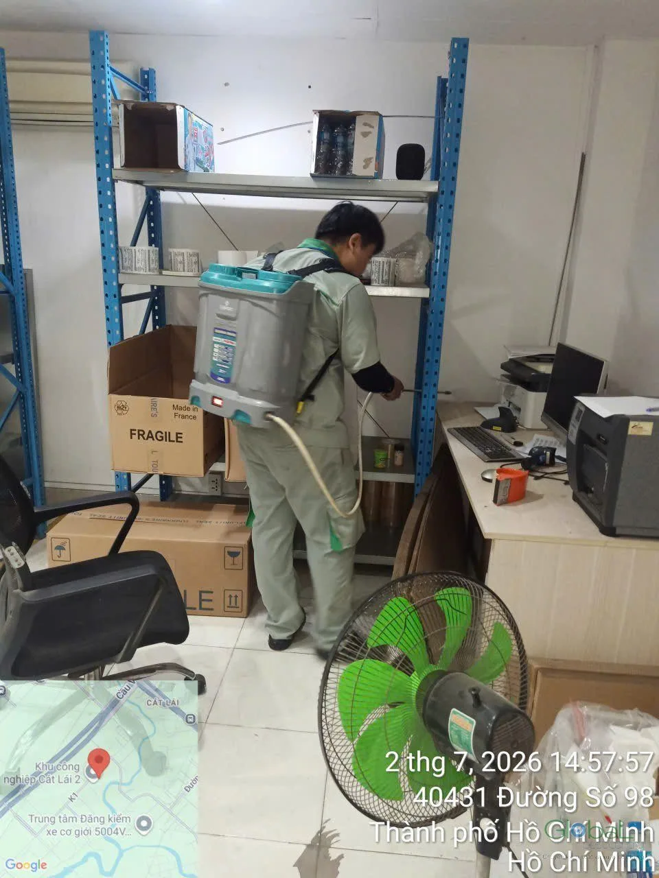 A technician treating an office equipment store room